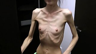 Half-starved Denisa posing mass beside up has ribs pretended